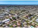 Community aerial view of winding streets surrounded by lush trees and waterways at 761 Vivienda South Ct # 14, Venice, FL 34293