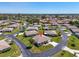 Community aerial view showing well-maintained homes and mature landscaping at 761 Vivienda South Ct # 14, Venice, FL 34293