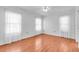 Bedroom with hard wood floors, white walls, and natural light at 761 Vivienda South Ct # 14, Venice, FL 34293