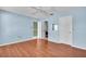 Bedroom with hardwood floors and light blue walls at 761 Vivienda South Ct # 14, Venice, FL 34293