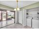 Laundry Room featuring white washer and dryer with access to the Lanai at 761 Vivienda South Ct # 14, Venice, FL 34293