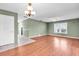 Bright living room with hardwood floors and a ceiling fan, creating a comfortable and inviting atmosphere at 761 Vivienda South Ct # 14, Venice, FL 34293