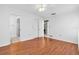 Main Bedroom featuring wood floors, ensuite bath, and ample closet space at 761 Vivienda South Ct # 14, Venice, FL 34293