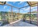 Outdoor patio with a privacy screen surrounded by lush landscaping at 761 Vivienda South Ct # 14, Venice, FL 34293