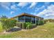 Screened patio with manicured landscaping, offering a serene outdoor living space with great privacy at 761 Vivienda South Ct # 14, Venice, FL 34293