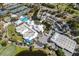 Aerial view of the community clubhouse, golf course, tennis courts, and pool at 782 Harrington Lake N Dr # 99, Venice, FL 34293