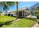 Expansive backyard with a covered patio, creating a perfect outdoor living space at 782 Harrington Lake N Dr # 99, Venice, FL 34293