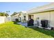 Lush backyard featuring a patio and well-maintained lawn perfect for outdoor relaxation and entertaining at 782 Harrington Lake N Dr # 99, Venice, FL 34293