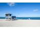 Tranquil beach scene with a lifeguard station and ocean views at 782 Harrington Lake N Dr # 99, Venice, FL 34293
