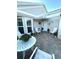 Charming courtyard features a brick-paved patio with a table and chairs, perfect for outdoor relaxation at 782 Harrington Lake N Dr # 99, Venice, FL 34293