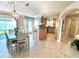 Spacious dining area adjacent to kitchen, perfect for gatherings with access to a lanai at 782 Harrington Lake N Dr # 99, Venice, FL 34293