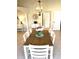Dining room with a decorative chandelier and stylish table decor, complemented by neutral paint colors at 782 Harrington Lake N Dr # 99, Venice, FL 34293