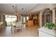 Spacious open-concept living area seamlessly connects dining and kitchen spaces with tiled floors at 782 Harrington Lake N Dr # 99, Venice, FL 34293
