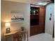 A cozy living room space with beautiful wood built-ins, a desk, and tiled floors at 782 Harrington Lake N Dr # 99, Venice, FL 34293