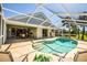 Inviting outdoor pool with patio and chairs with an adjacent screened-in lanai for relaxation and entertainment at 782 Harrington Lake N Dr # 99, Venice, FL 34293