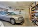 Garage featuring an old car, a door to the backyard, and shelves at 820 Capri Isles Blvd # 202, Venice, FL 34292