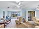 Living room with neutral colors and large window, offering stunning views at 820 Capri Isles Blvd # 202, Venice, FL 34292