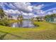 Beautiful lake view within the community, featuring a fountain at 820 Capri Isles Blvd # 202, Venice, FL 34292