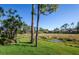 This home offers a spacious backyard with a peaceful view and luscious lawn at 835 Chalmers Dr # 835, Venice, FL 34293