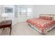 Inviting bedroom featuring a bay window, neutral carpet and a decorative lamp at 835 Chalmers Dr # 835, Venice, FL 34293