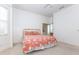 Bright bedroom featuring a bay window, neutral carpet, and a stylish bedspread at 835 Chalmers Dr # 835, Venice, FL 34293
