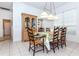 Charming dining room with a large display cabinet and natural light at 835 Chalmers Dr # 835, Venice, FL 34293