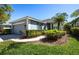 Beautiful single-story home boasting an attached garage and lush, green landscaping at 835 Chalmers Dr # 835, Venice, FL 34293