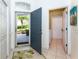 Bright foyer featuring tile flooring, open doorway and view into the front garden at 835 Chalmers Dr # 835, Venice, FL 34293