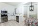 Bright kitchen includes stainless steel appliances, white cabinetry, and breakfast nook with lots of natural light at 835 Chalmers Dr # 835, Venice, FL 34293
