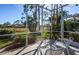 Relax in this screened lanai with an eye-pleasing view of the luscious greenery beyond at 835 Chalmers Dr # 835, Venice, FL 34293