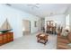 Spacious living area showcasing access to the dining room and bright views at 835 Chalmers Dr # 835, Venice, FL 34293