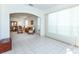 Open concept living and dining area with tile flooring and stylish furnishings at 835 Chalmers Dr # 835, Venice, FL 34293