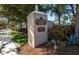A prestigious community, marked by an elegant entrance sign amidst beautiful landscaping, offering refined living and exclusivity at 835 Chalmers Dr # 835, Venice, FL 34293