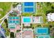 Bird's eye view of community amenities including a pool, tennis courts, shuffleboard, and clubhouse at 838 Bird Bay Way # 114, Venice, FL 34285