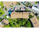 Overhead of a condominium building with covered parking, landscaped grounds, and a park-like setting at 838 Bird Bay Way # 114, Venice, FL 34285