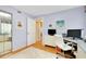Bedroom/office space with hardwood floors, ample lighting and closet at 838 Bird Bay Way # 114, Venice, FL 34285