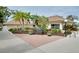 Community center building with seating area and attractive landscaping at 838 Bird Bay Way # 114, Venice, FL 34285