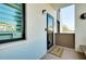 Charming condo front entrance with welcoming decor, including a decorative wreath and a cute doormat at 838 Bird Bay Way # 114, Venice, FL 34285