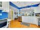 Spacious kitchen with stainless steel appliances, granite countertops, and a view into the living area at 838 Bird Bay Way # 114, Venice, FL 34285
