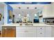 Well-lit kitchen featuring granite countertops, stainless steel appliances, and open access to the living space at 838 Bird Bay Way # 114, Venice, FL 34285