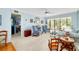 Living room with comfortable seating and view to sunroom at 838 Bird Bay Way # 114, Venice, FL 34285