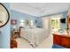 Comfortable main bedroom featuring a large bed and sliding glass doors to a patio at 838 Bird Bay Way # 114, Venice, FL 34285