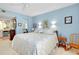 Comfortable bedroom featuring a large bed, and ensuite bath at 838 Bird Bay Way # 114, Venice, FL 34285