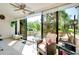 Sunroom featuring an outdoor deck with a swing at 838 Bird Bay Way # 114, Venice, FL 34285