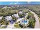 Aerial view featuring a lovely community and surrounding green space with a community pool at 921 Tartan Dr # 31, Venice, FL 34293