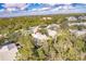 An aerial shot of the community's tree-lined streets and the neighboring properties at 921 Tartan Dr # 31, Venice, FL 34293