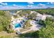 Aerial view of a serene community featuring a swimming pool and well-maintained landscaping at 921 Tartan Dr # 31, Venice, FL 34293