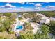 Beautiful community aerial view showcasing a pool, nearby pond, and lush landscaping at 921 Tartan Dr # 31, Venice, FL 34293