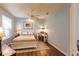 Comfortable bedroom with a queen bed, desk area, ceiling fan, and bright window with shutters at 921 Tartan Dr # 31, Venice, FL 34293