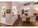 Dining room with chandelier and partial view of kitchen with bar, plus a view of the living room at 921 Tartan Dr # 31, Venice, FL 34293